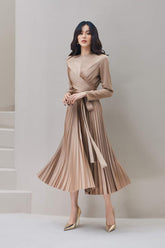 High-waisted pleated silk skirt with wrap detail and asymmetric hem for elegant movement